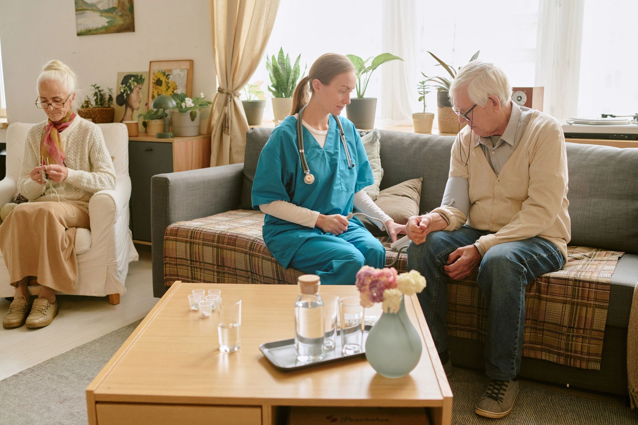 Nurse assisting a senior patient during care